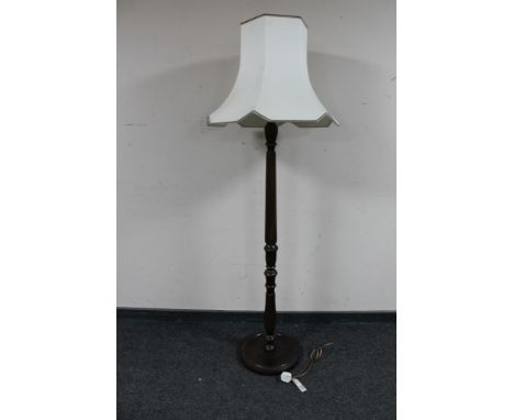 A beech wood standard lamp with shade  CONDITION REPORT: Tested and working although without guarantee.