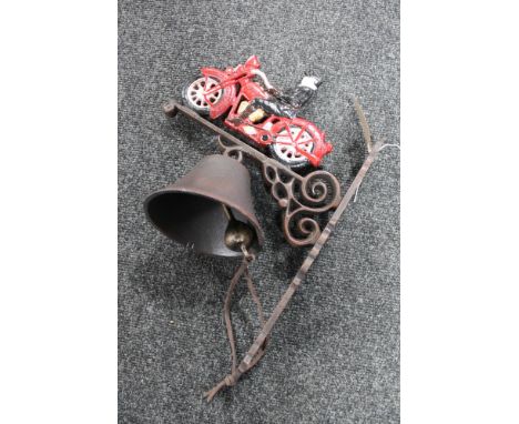 A cast iron vintage car bracket with bell 