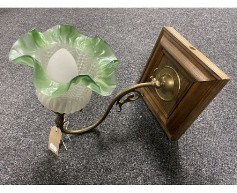 An antique brass-armed gas light fitting with green and opaque glass shade (converted)