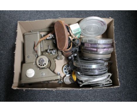 A box of leather cased Marnix 12 x 40 binoculars, vintage projector and reels  CONDITION REPORT: The reels are not in good co