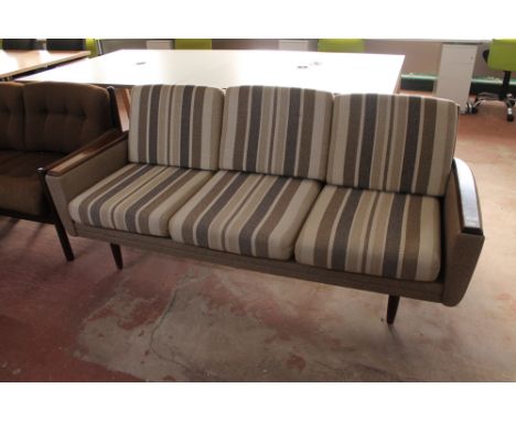 A mid century Danish teak armed three seater settee in a striped fabric  CONDITION REPORT: 186cm long. Typical light scuffs t