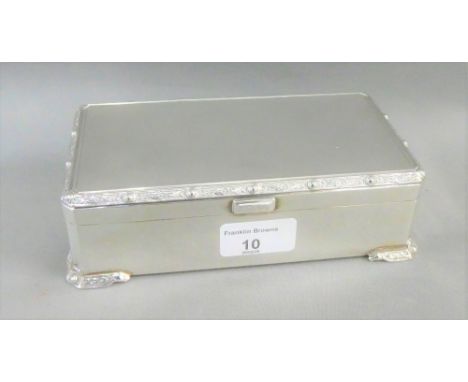 George V silver table cigarette box, Brook &amp; Sons Sheffield 1934, the hinged lid with engine turned decoration and Celtic