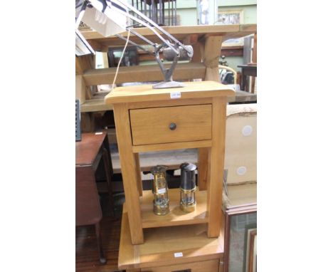 A MODERN OAK FINISHED LAMP TABLE with single drawer and solid undertier 