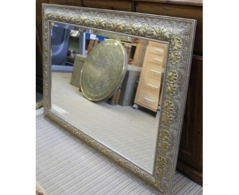A FANCY MOULDED PART SILVERED FRAMED RECTANGULAR BEVEL PLATE MIRROR 