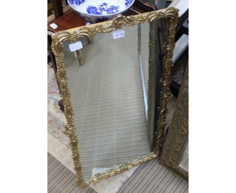 A FANCY MOULDED GILT FRAMED PLAIN PLATE RECTANGULAR MIRROR 