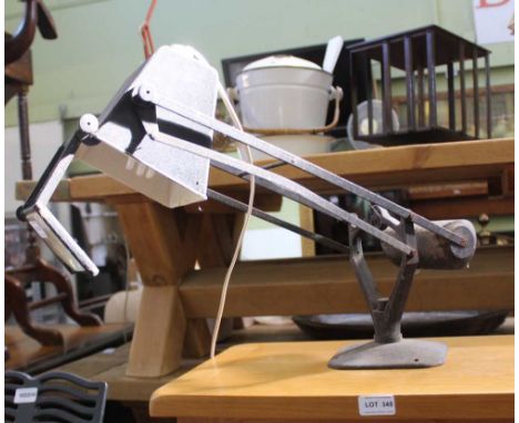 A COUNTER WEIGHT ADJUSTABLE TASK LIGHT with magnifier 