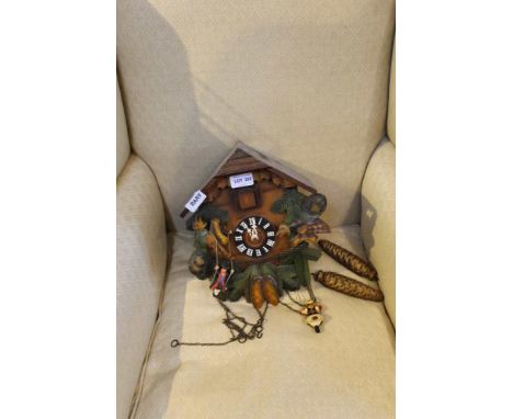 A 20TH CENTURY DECORATIVE WOODEN CUCKOO CLOCK 
