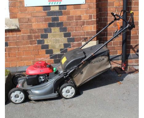 A HONDA HYDROSTATIC PETROL DRIVEN LAWNMOWER with grass collection box, model HRX 537 (recently used &amp; serviced at a cost 