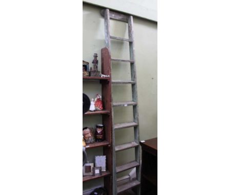 A WOODEN BUILT DISPLAY LADDER with eight treads, approx. 245cm long 