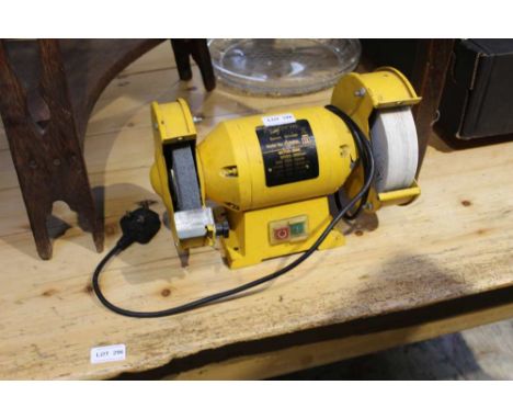 A SMALL YELLOW FINISHED ELECTRONIC BENCH GRINDER 