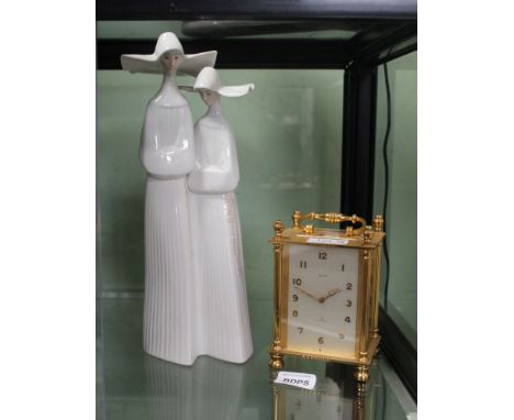 A MANTEL CLOCK AND A LLADRO FIGURINE 