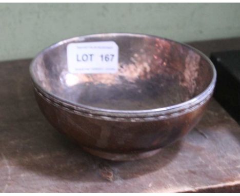 A LATE 19TH CENTURY CHINESE SILVER LINED COCONUT BOWL, character mark seal stamped to the inner bowl, characters carved into 