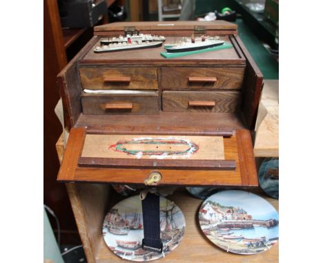 A WOODEN BOX CONTAINING MINIATURE MODEL BOATS, and model making equipment 