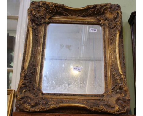 A LARGE FANCY GILT FRAMED RECTANGULAR BEVEL PLATE WALL MIRROR 