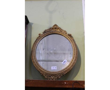 A FANCY MOULDED GILT FRAMED OVAL PLAIN PLATE WALL MIRROR 
