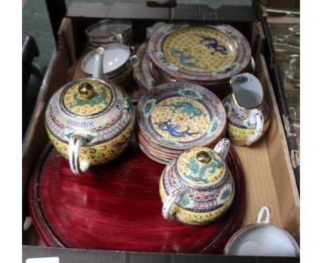 A BOX CONTAINING AN ORIENTAL TEA SERVICE decorated in Hong Kong 