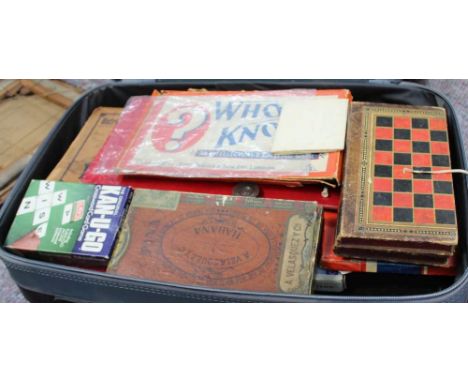 A SUITCASE CONTAINING A SELECTION OF VINTAGE GAMES 