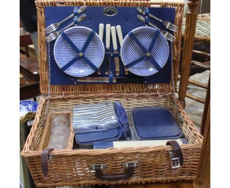 A WOVEN WICKER PICNIC HAMPER, plus contents, produced by Optima 
