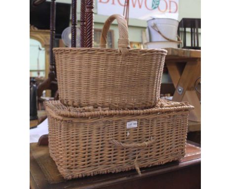 A WOVEN WICKER HAMPER together with a fixed handle basket 