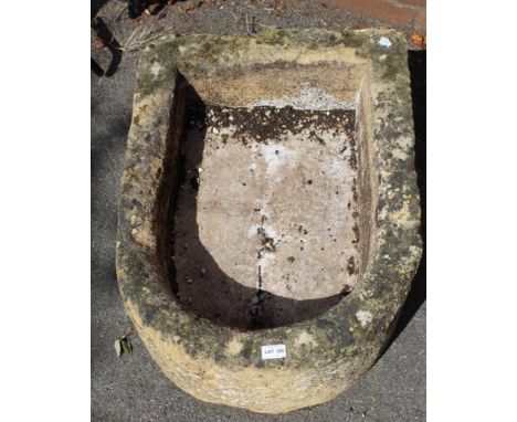 A HAND HEWN COTSWOLD STONE D-SHAPED PLANTER 31cm high, 73cm in length 