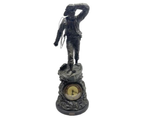 Early 20th century spelter effect figure of a sailor standing in the bow of a boat scanning the horizon, on a simulated rock 