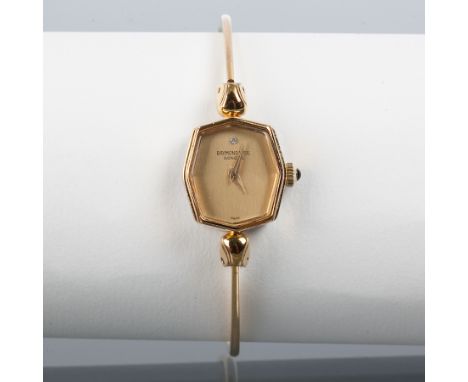 LADY'S RAYMOND WEIL BANGLE WATCH
with an accent diamond at 12, and with a sapphire cabochon in the crown, in a gilt case