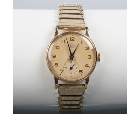 GENTLEMAN'S 1960s SMITHS DELUXE NINE CARAT GOLD WRISTWATCH
the champagne dial with stylised Arabic numerals and subsidiary se
