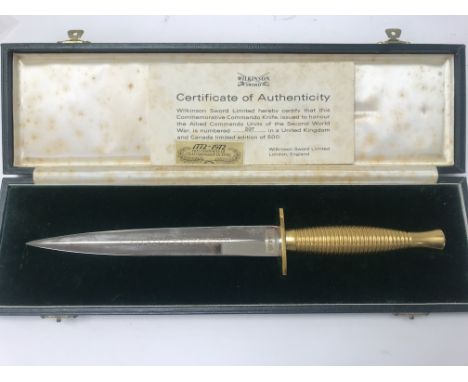 A presentation copy Wilkinson swords Fair burn Sykes commando knife. Length approx 39.5cm.
