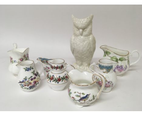 A collection of porcelain jugs including Worcester and Royal Albert a collection of tea pots and other ceramics. With certifi