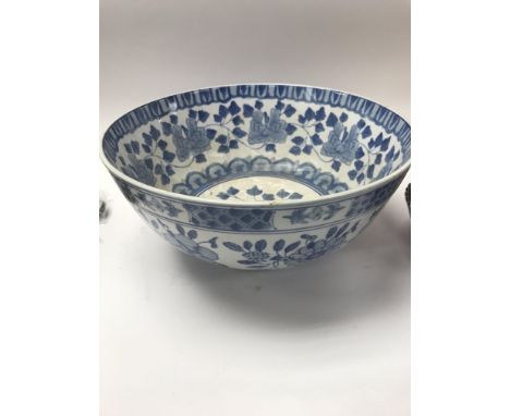 Two ceramic bowls along with a collection of glass blue jugs and bowls etc.