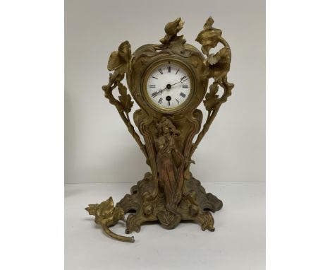 A large Art Noveau gilt spelter mantle clock with figural and floral decoration. 39cm. (No Pendulum or key)