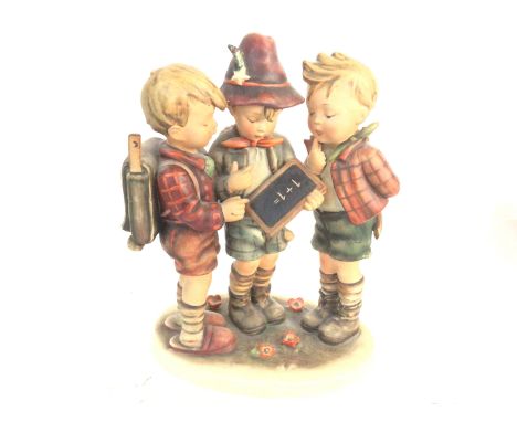 A large Goebel Hummel figurine of school boys. 24cm tall by 20cm wide. Postage D