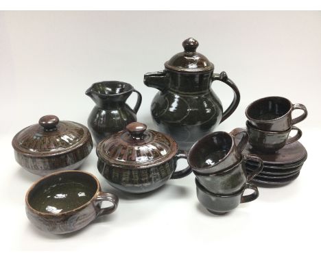 A Michael Cardew Abuja coffee set plus a larger cup and two pots with covers. Shipping category D.