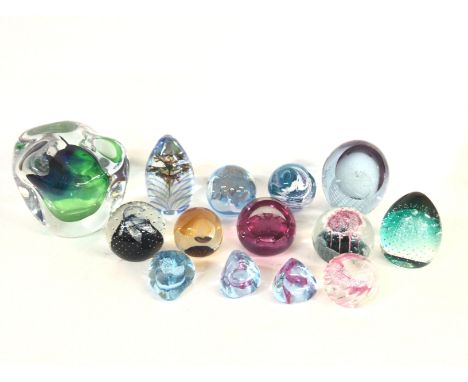 A collection of paperweights including Caithness glass.