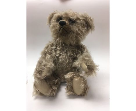 A boxed Steiff grizzly teddy bear.