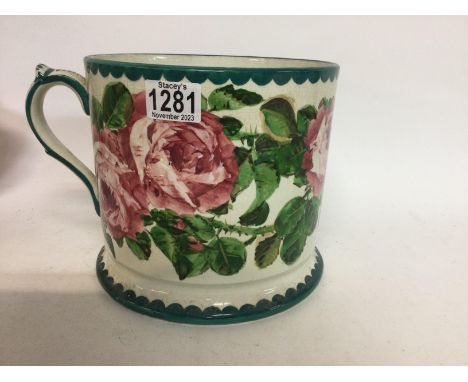 A large Wemyss ware tankard decorated in cabbage rose 19 cm 21 cm .