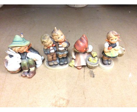 Collection of Goebel figures. The one on far right has missing basket handle. Postage D