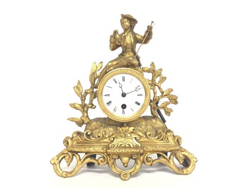 A Victorian Gilt mantle clock with key and pendulum , postage category C