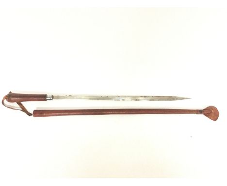 An Indian sword stick with a leather scabbard. 57cm long.