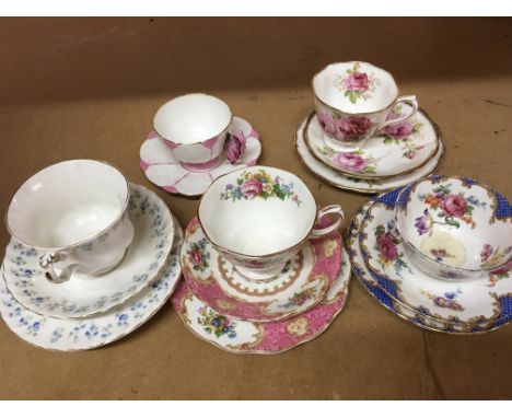 A collection of cups and saucers including royal Albert and Aynsley.
