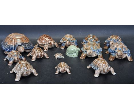 A collection of vintage 20th century ceramic tortoise by Wade of various sizes. All having polychrome decoration and mark to 