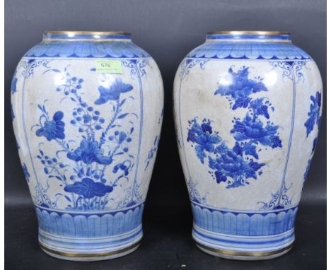 A large pair of vintage 20th century Chinese Oriental ceramic blue and white vases having a crackle glaze finish, gilt rims, 