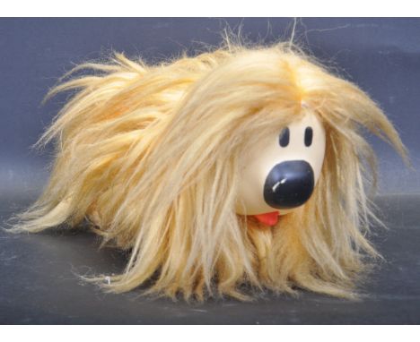 A vintage retro 20th century Pelham Puppet Magic Roundabout Dougal. The toy figurine having yellow fur, black eyes and nose a