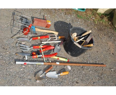 Quantity of Wolf tools, garden hand tools, axe and various other garden hand tools.