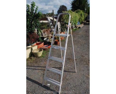 Four rung pair of aluminium step ladders.