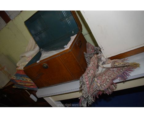 A metal trunk containing bed linen, curtains, down pillows etc.