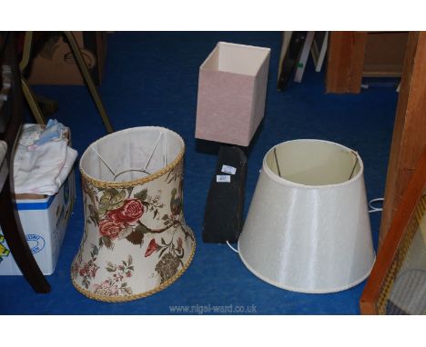 A slate table lamp and shades.