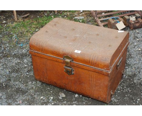 A metal travel trunk.