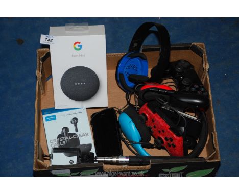 A Google Nest Mini, selfie stick, Playstation controllers etc.