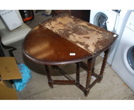 Domed end gate leg table with barley twist legs.